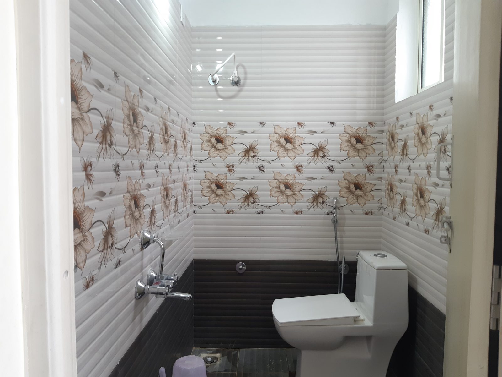 Private bathroom with overhead shower, health faucet and Western toilet
